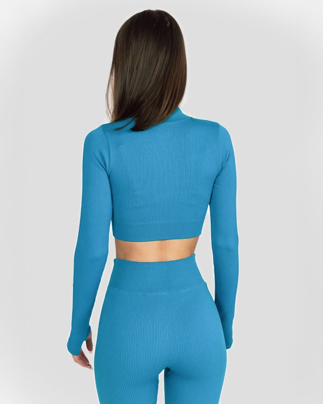 Dámský modrý crop top s dlouhým rukávem, ideální na fitness i volné chvíle