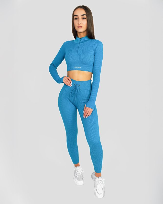 Dámský modrý crop top s dlouhým rukávem, ideální na fitness i volné chvíle